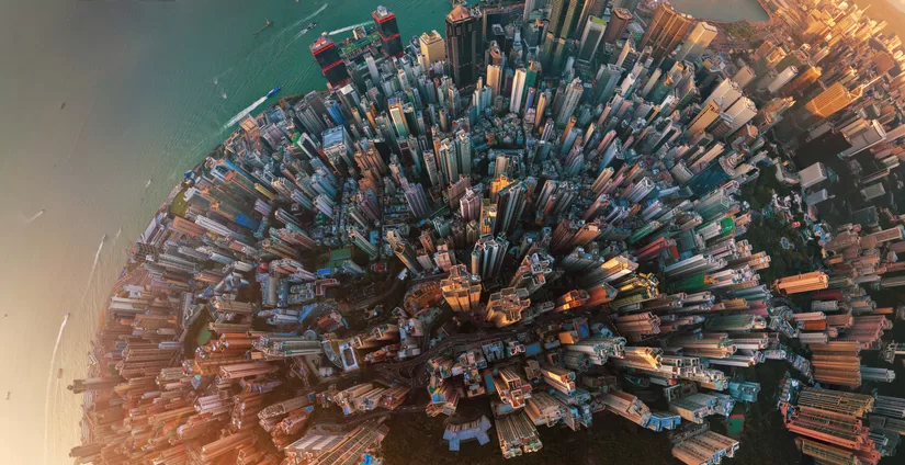 Little planet. Aerial view of Hong Kong Downtown. Financial district and business centers in smart city in Asia. Top view. Panorama of skyscraper and high-rise buildings.